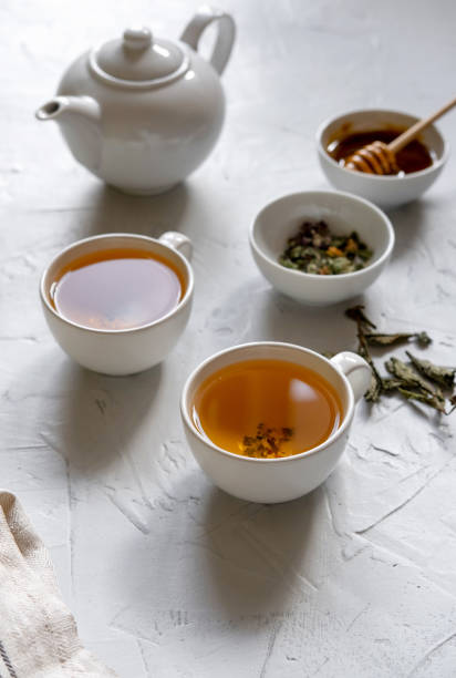 istock Floral green tea on table with tea kettle and napkin 1180012678
