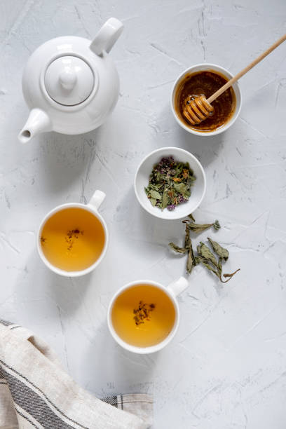 istock Floral green tea on table with tea kettle and napkin 1180012687