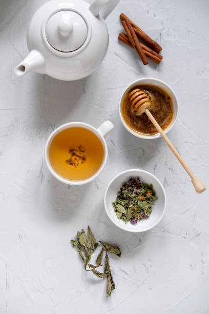 istock Floral green tea on table with tea kettle and napkin 1180012723