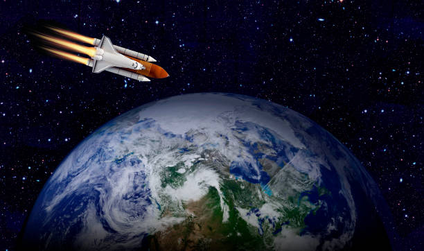 istock Space shuttle orbiting Earth planet. Elements of this image furnished by NASA 1180013037