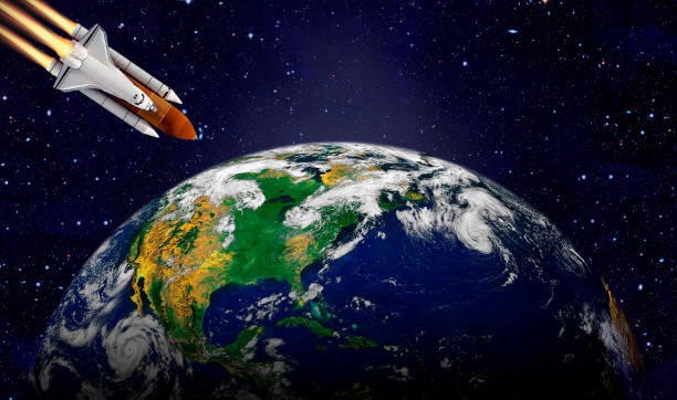 istock Space shuttle orbiting Earth planet. Elements of this image furnished by NASA 1180013056