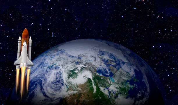 istock Space shuttle orbiting Earth planet. Elements of this image furnished by NASA 1180013057