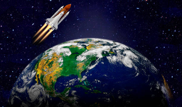istock Space shuttle orbiting Earth planet. Elements of this image furnished by NASA 1180013085
