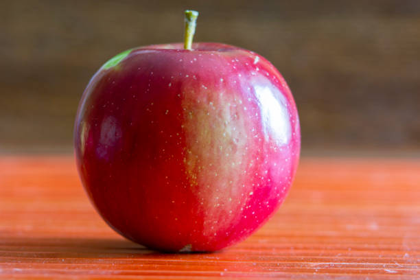 istock Juicy ripe red apples on the table 1180014108