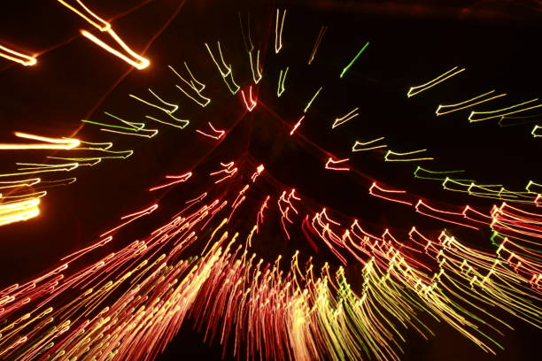 istock Glowing abstract Colorful light trail lines on dark background. 1180014814