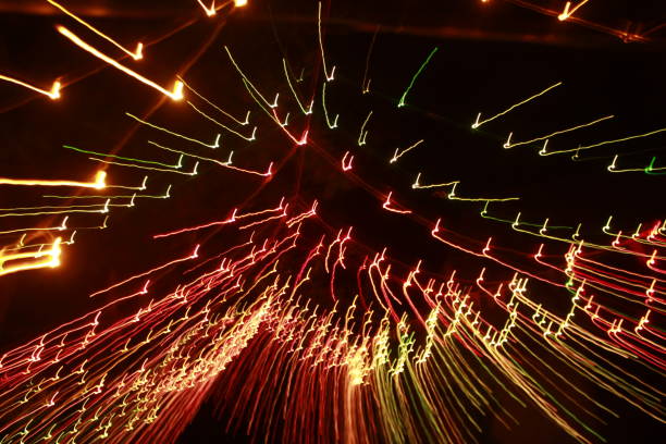 istock Glowing abstract Colorful light trail lines on dark background. 1180014837