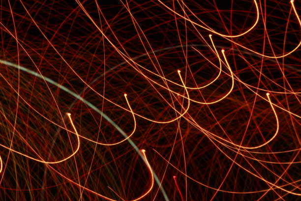 istock Glowing abstract Colorful light trail lines on dark background. 1180014868
