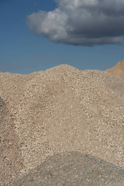 istock Mountains of sand and stone against a blue sky 1180016751
