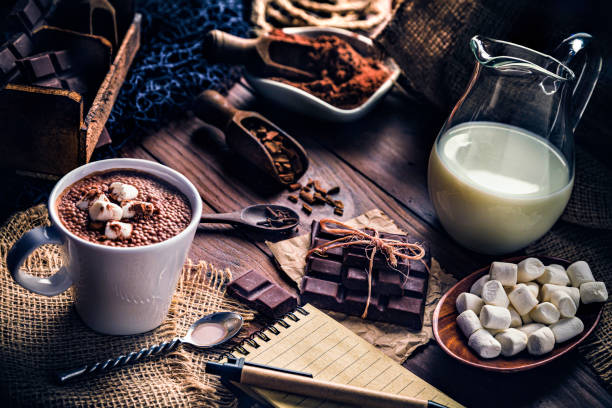 istock Christmas table setup with homemade chocolate mug, marshmallows and note pad 1180017199