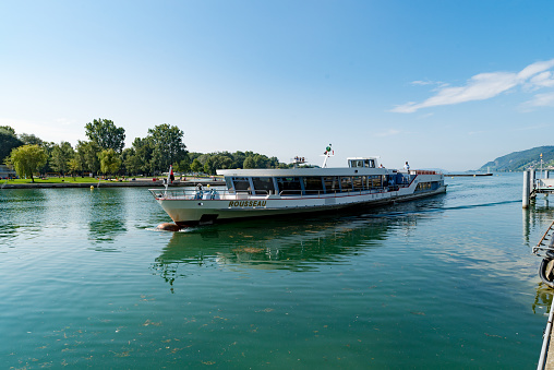 Biel, BE / Switzerland - 28 August 2019: large public transport passenger ship enters the harbor in Biel on the Bielersee Lake