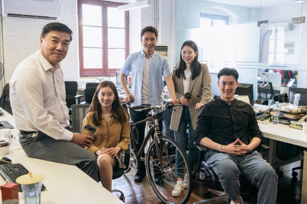 istock Manager with young business colleagues in Shanghai office 1180018090