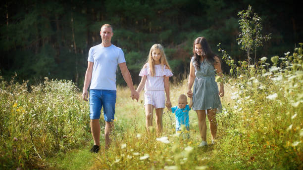 istock Family walking in forest 1180018564