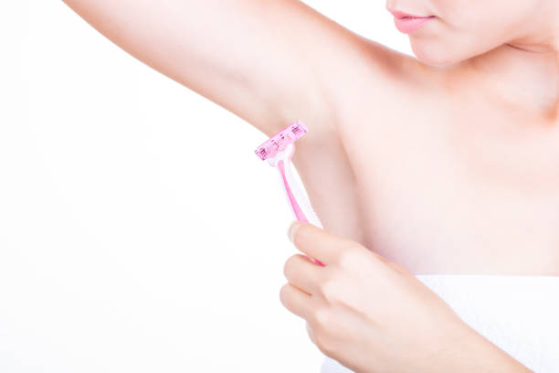 istock Woman in hand razors shaving 1180019960