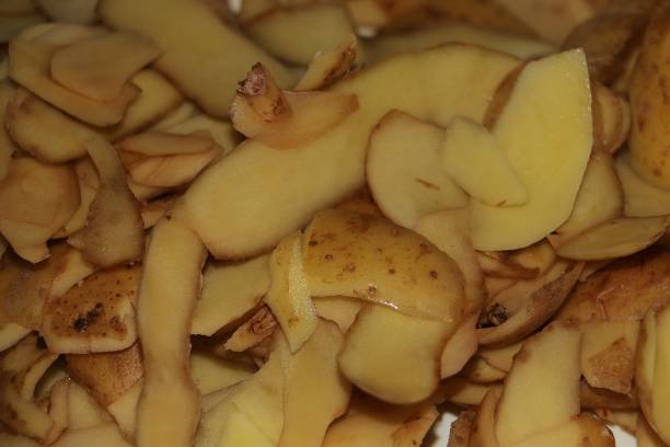 istock Closeup of shelled potato peels 1180020167