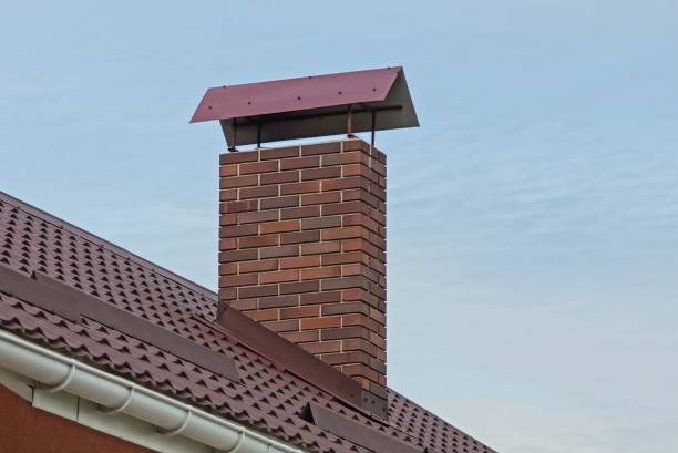 istock one large brown brown chimney pipe on a tiled roof 1180028081