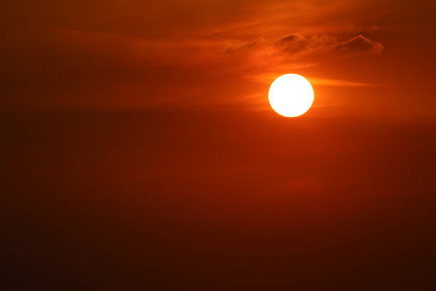 istock sunset on dark red orange sky back evening cloud over space 1180036707