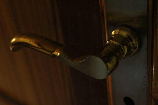 istock golden door handle in closeup 1180038307