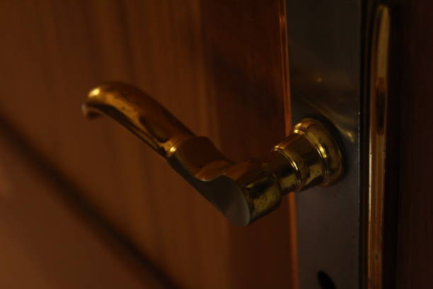 istock golden door handle in closeup 1180038356
