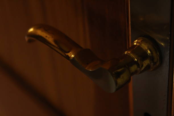 istock golden door handle in closeup 1180038599