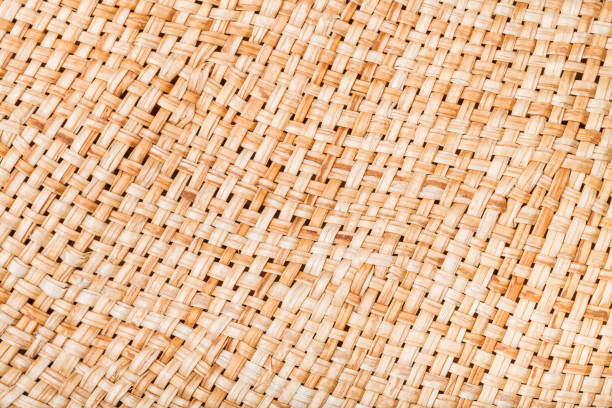 istock weaving of straw hat from natural raffia fibers 1180040838