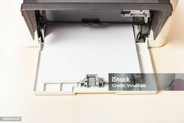 Sheets Of Blank White Paper In Printer Tray Stock Photo - Download Image Now - Blank, Brown, Business