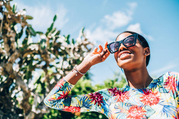 istock Young Black woman at tropical beach 1180043039