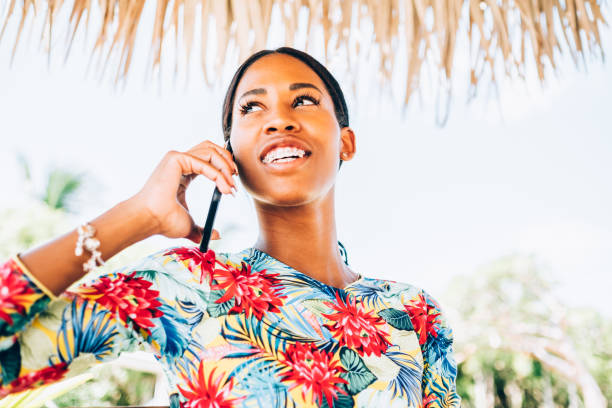 istock Young Black woman at resort cabana 1180043127