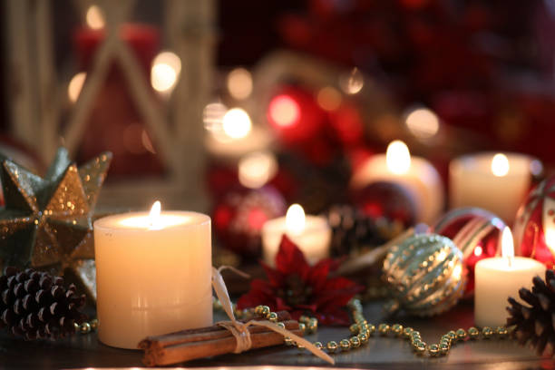 istock Christmas holiday decorations, candles on table. 1180043577