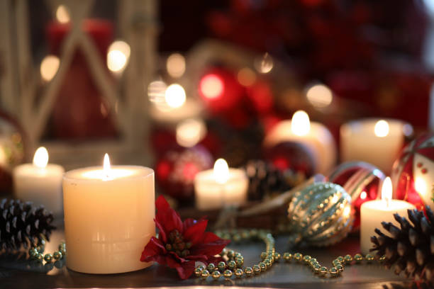 istock Christmas holiday decorations, candles on table. 1180043828