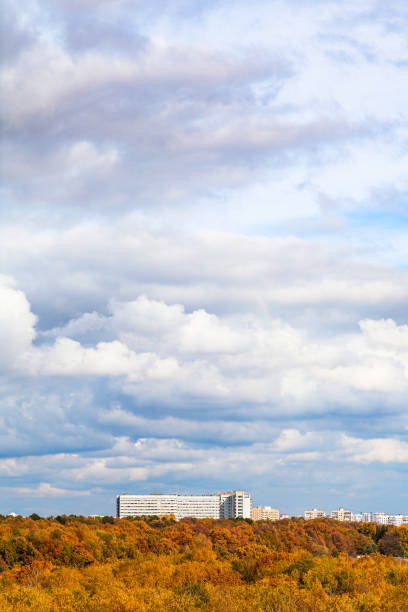 istock white and gray clouds over yellow city park 1180047838