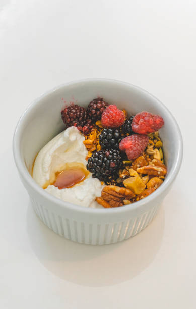 istock Yogurt and Granola with Fresh Berries and Maple Syrup 1180049149