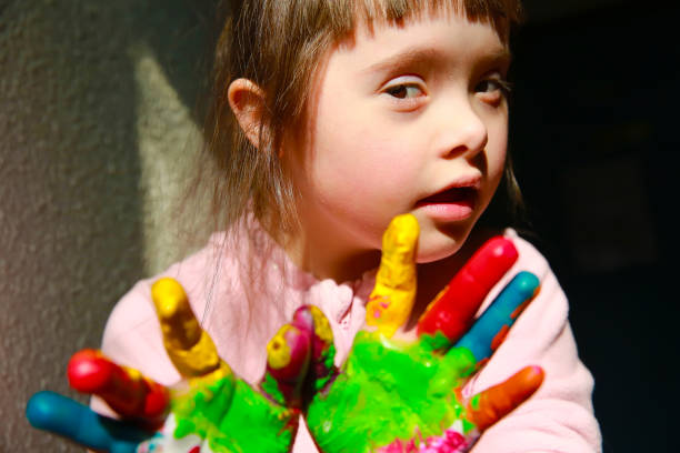 istock Cute little girl with painted hands. 1180049151