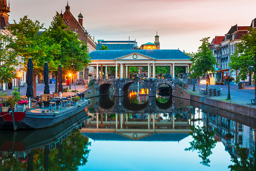 Historical, touristic Dutch town Leiden city hall koornbrug and canals during dusk