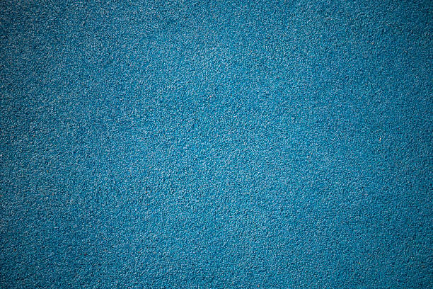 istock Rubber floor texture. Granules playground cover background. 1180051124