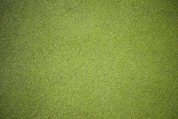 istock Rubber floor texture. Granules playground cover background. 1180051167