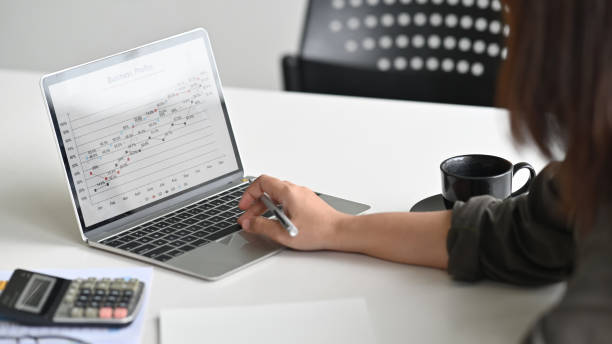 istock Cropped shot Businesswoman analyst business data in laptop computer. 1180053842