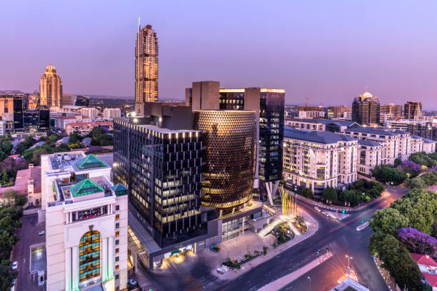Sandton City panoramic at dusk with the Leonardo building Sandton City panorama at dusk with the Leonardo building, Michelangelo apartments and sandton city office towers.
Sandton has become home to most of the major financial, consulting and banking firms in South Africa.  Sandton houses approximately 300000 residents and 10 000 businesses, including investment banks, top businesses, financial consultants, the Johannesburg stock exchange and one of the biggest convention centres on the African continent, the Sandton Convention Centre. johannesburg photos stock pictures, royalty-free photos & images