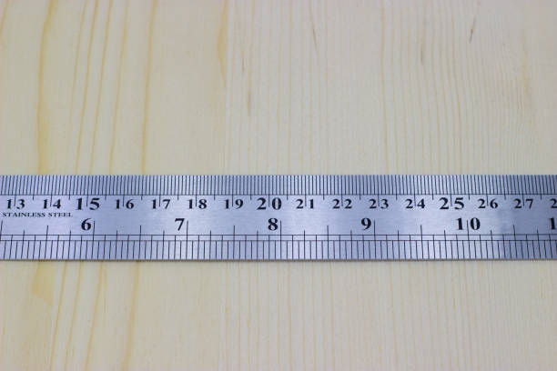 istock metal carpentry ruler on a light wooden background 1180054070