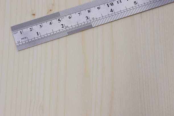 istock metal carpentry ruler on a light wooden background 1180054081