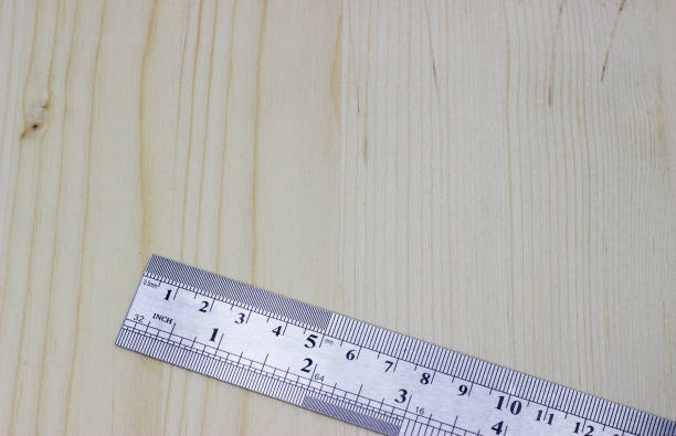 istock metal carpentry ruler on a light wooden background 1180054091