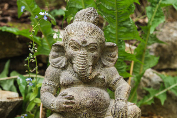 istock Ganesha stone statue in a garden 1180055280