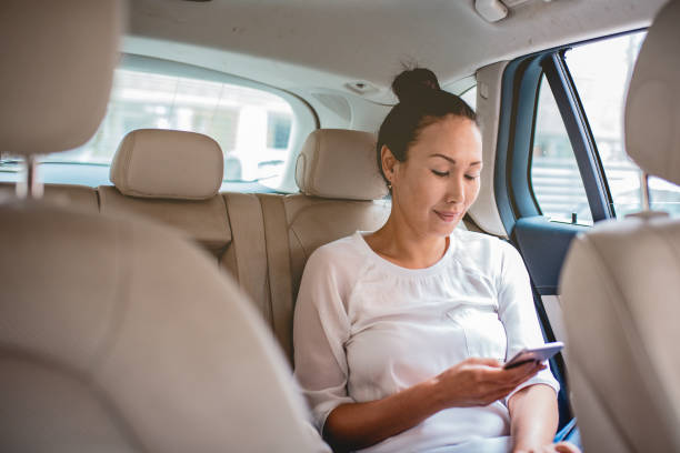 istock Asian woman in car 1180057046