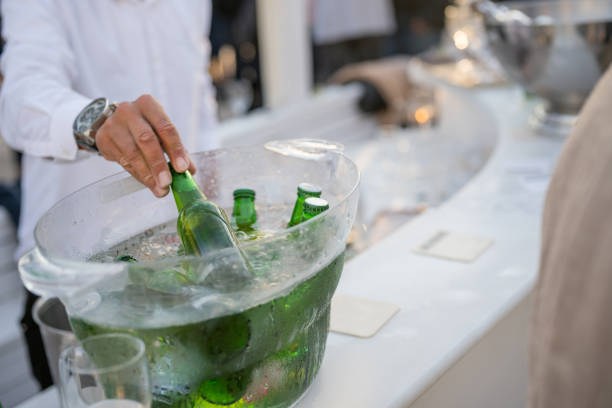 Unrecognizable waiter serving beer at a outdoor party, Nikon Z7