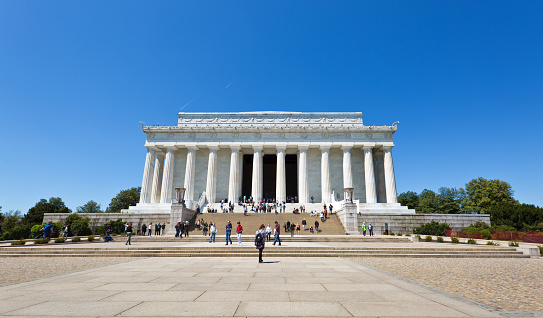 The Lincoln Memorial in Washington DC, USA. A popular tourists destination in the city. A majestic building overlooking the reflecting pool across from the Washington Monument.