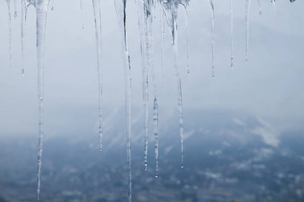 Detail of icicle formation in a window, abstract wintry nature background