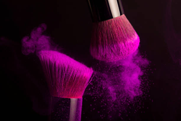 istock Cosmetics brush and colorful makeup powder 1180061371