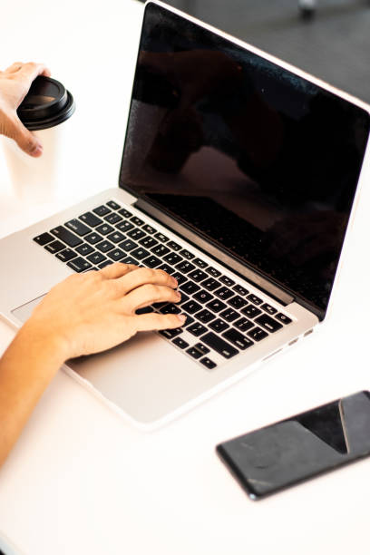 istock Close up on a woman's laptop female freelance 1180062533