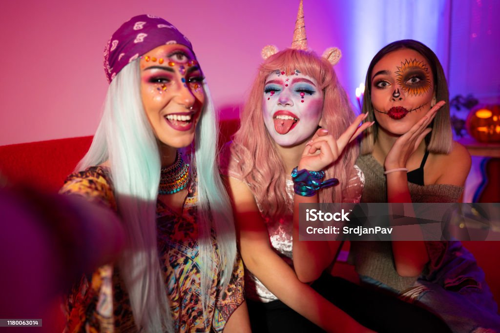 Halloween girls Girls taking selfies at Halloween party. Halloween Stock Photo
