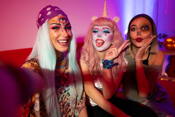 Halloween girls Girls taking selfies at Halloween party. halloween costume stock pictures, royalty-free photos & images