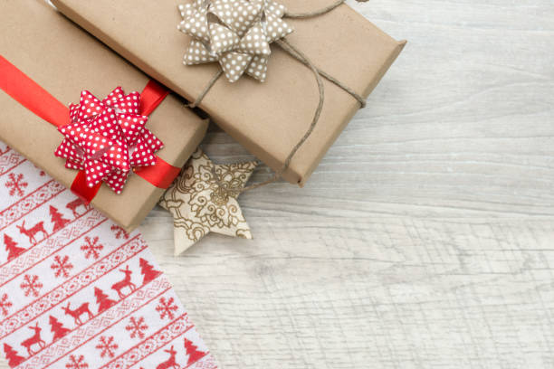 istock Christmas background with decorations and gift boxes on wooden board 1180064117